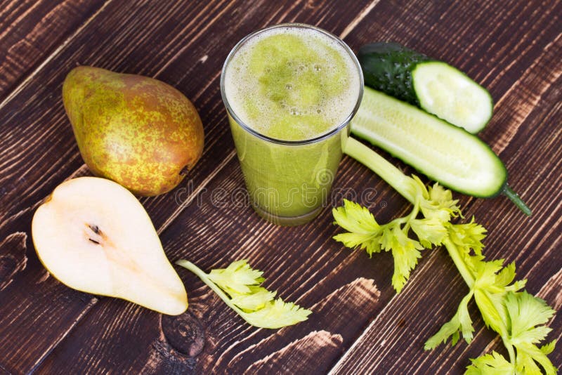 Fresh cucumber, pear and celery juice. Slices of fruits and vegetables