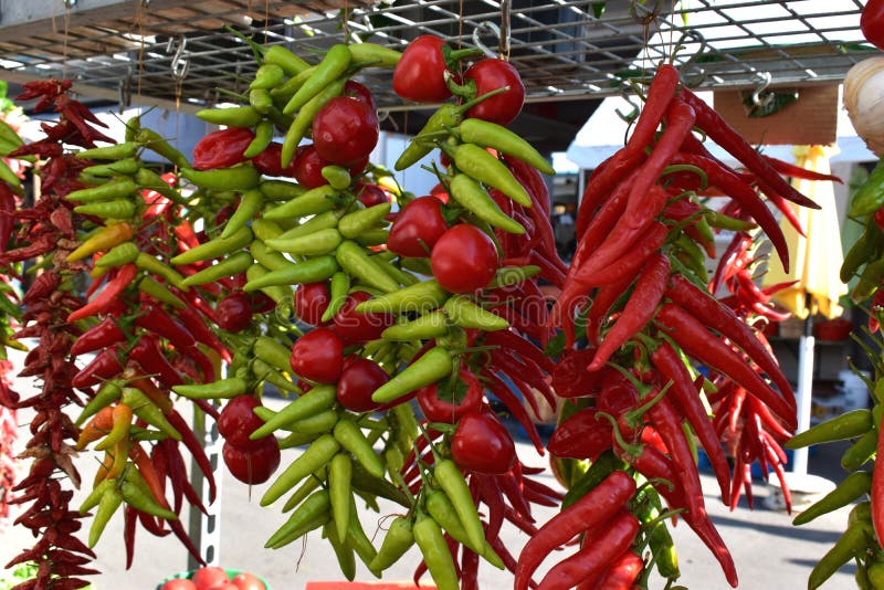 Fresh and dried red and green chili peppers hanging in the morning Market, stock photo Fresh and dried red and green chili peppers hanging in the morning Market, stock photo