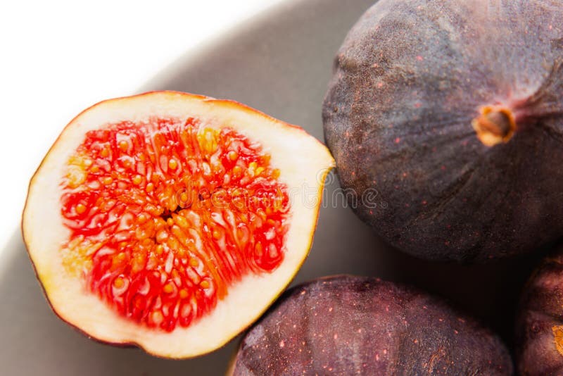 Fresh Figs on Grey Plate. Fruit with Half on White. Stock Image Image