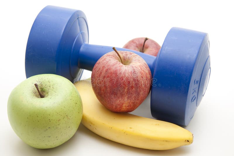 Fresh fruit and dumbbell