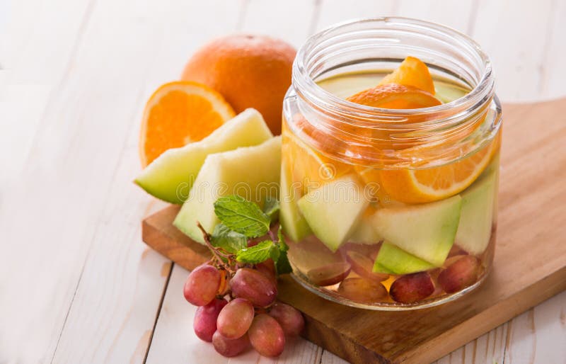 Fresh Fruit Flavored Infused Water Mix of Orange, Grape and Melo Stock