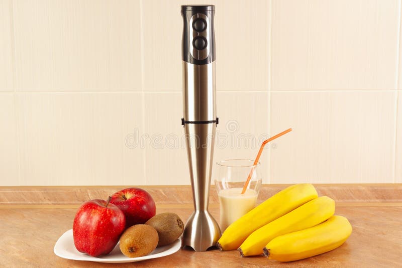 Fresh Fruit, Glasses and Blender To Prepare Milkshake Stock Photo