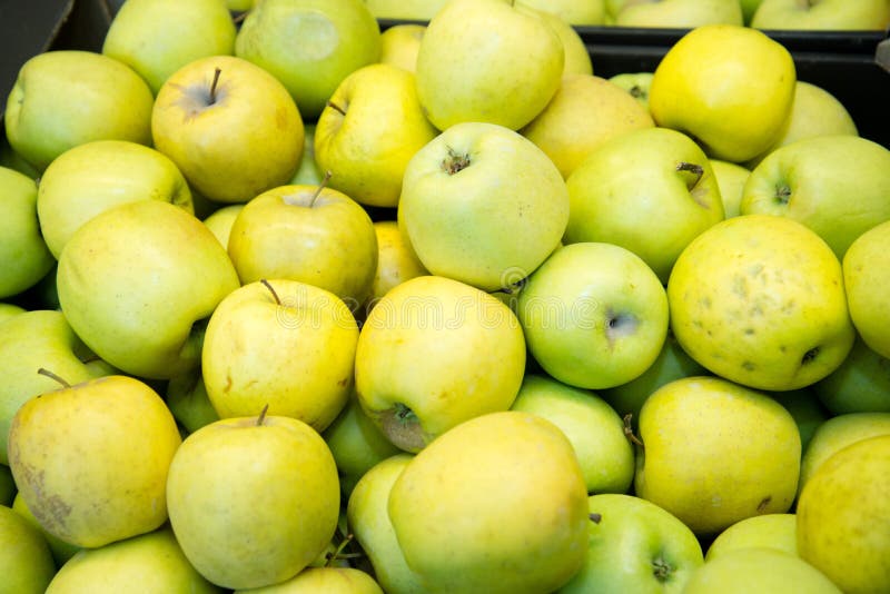 Fresh Fruit, Many Ripe Apples on the Counter in the Supermarket Stock