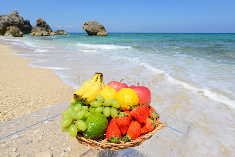 Fresh fruits on the beach stock photo. Image of island 39928744
