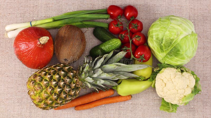 Fresh fruits and vegetables appear and filling the table. Stop motion