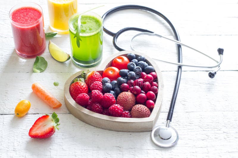 Fresh fruits vegetables and heart shape with stethoscope health diet concept