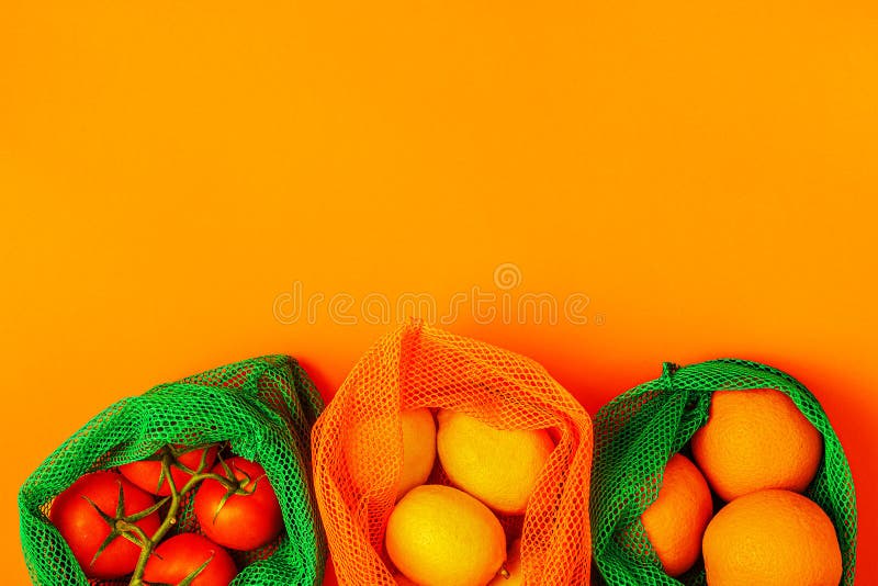 Fresh fruits and vegetables in reusable textile mesh bags stock photos Fresh fruits and vegetables in reusable textile mesh bags stock photos
