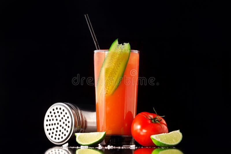 Fresh glass of bloody mary cocktail decorated with lime