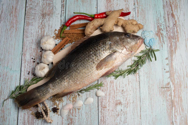 Golden Eye Snapper Simmered in Soy Sauce Stock Photo - Image of spinach,  grill: 168189888