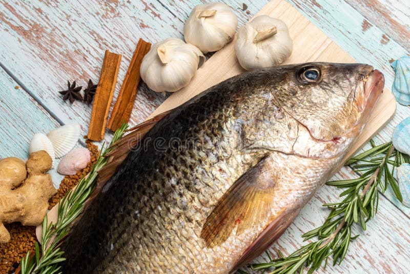 Golden Eye Snapper Simmered in Soy Sauce Stock Photo - Image of spinach,  grill: 168189888