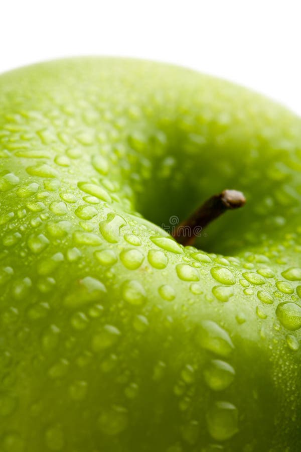 Fresh green apple with water droplets isolated