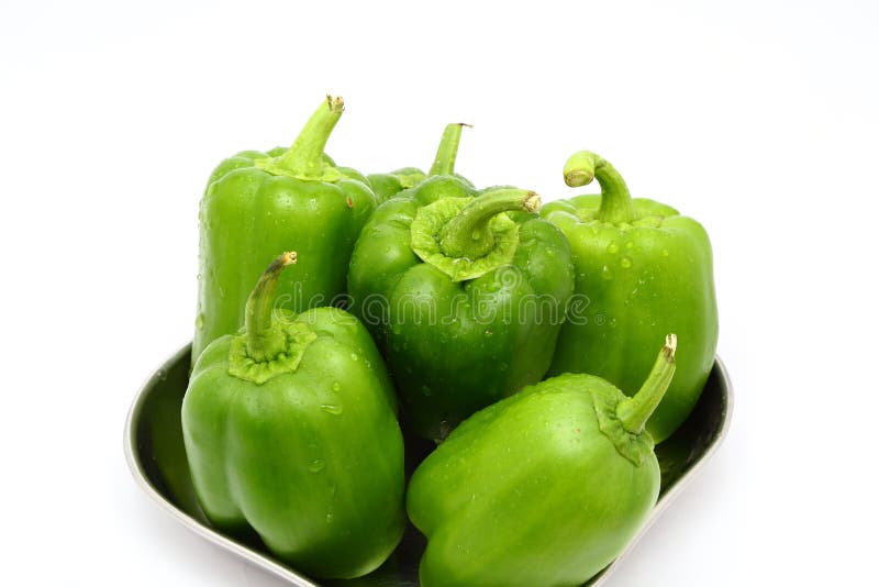 Fresh green bell peppers (capsicum) on a white background royalty free stock photography Fresh green bell peppers (capsicum) on a white background royalty free stock photography