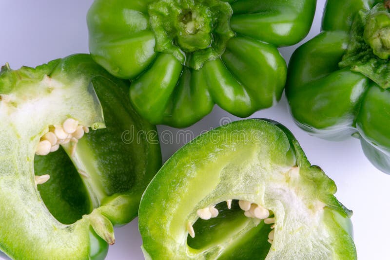 Fresh Green Bell Peppers Capsicum on a White Background. Stock Photo