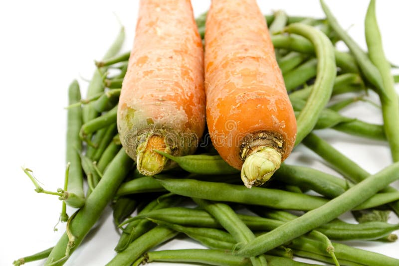 Fresh Green Stick beans with Carrots royalty free stock images