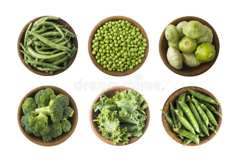 Fresh green vegetables isolated on a white background. Squash, green peas, broccoli, kale leaves and green bean in wooden bowl. Ve