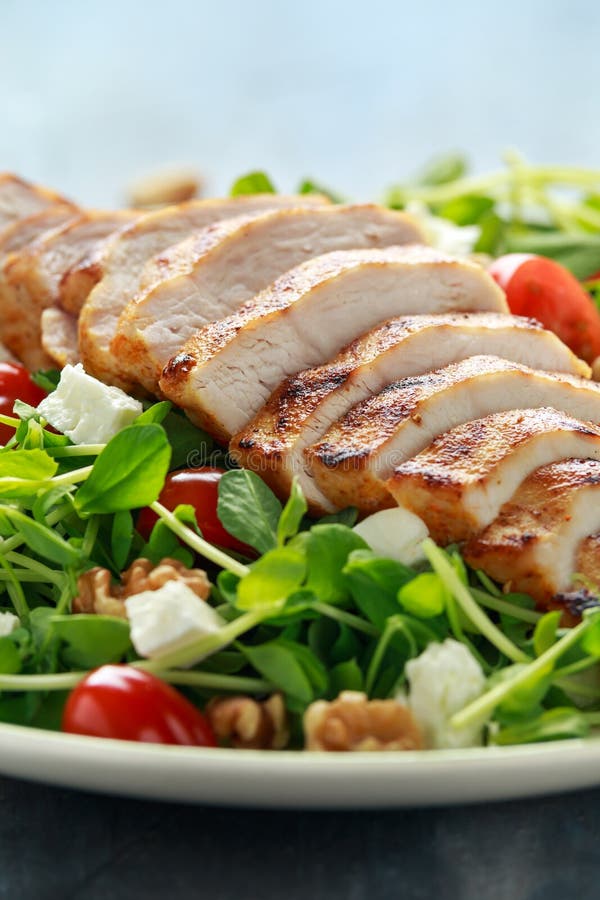 Fresh Grilled Chicken Salad with Tomatoes, Feta Cheese Stock Photo