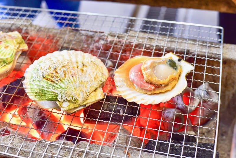 Fresh Grilled Japanese Scallops or Hotate on Flame stock image Fresh Grilled Japanese Scallops or Hotate on Flame stock image