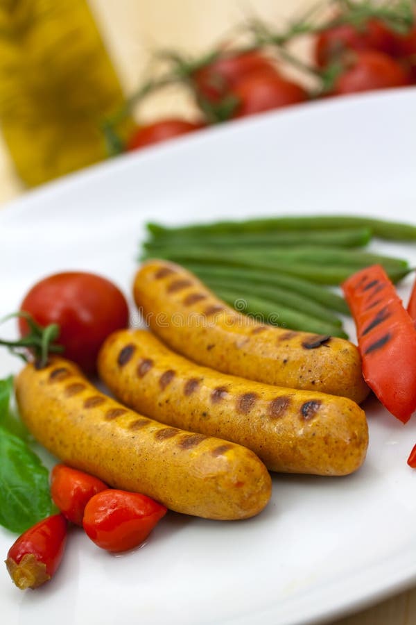 Fresh grilled sausages with red bell pepper