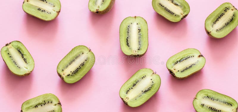 Fresh halves of kiwi on a pink background stock photography Fresh halves of kiwi on a pink background stock photography