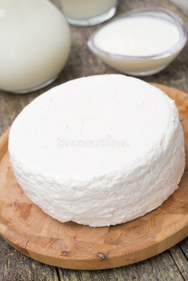 Fresh homemade cottage cheese, yogurt and milk, selective focus