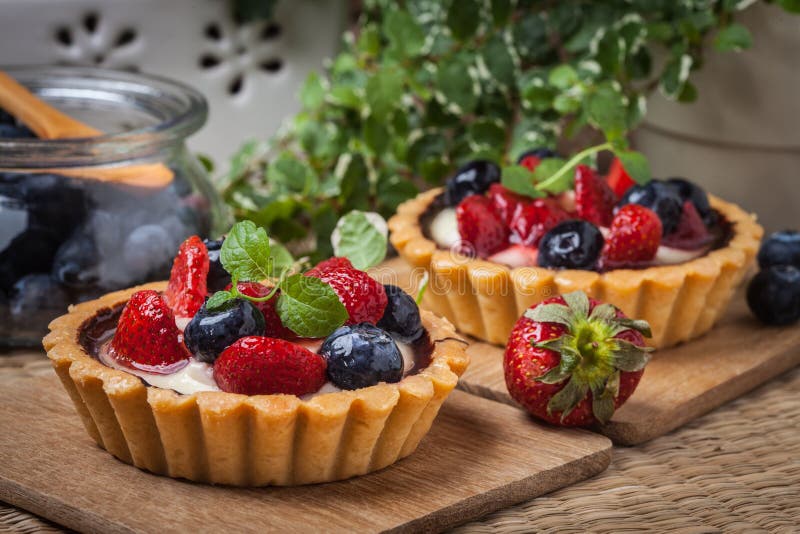 Fresh homemade fruit tart with strawberries and blueberries.