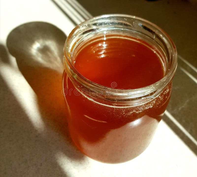 Fresh honey in a jar stock photo. Image of shining, honey 97031418