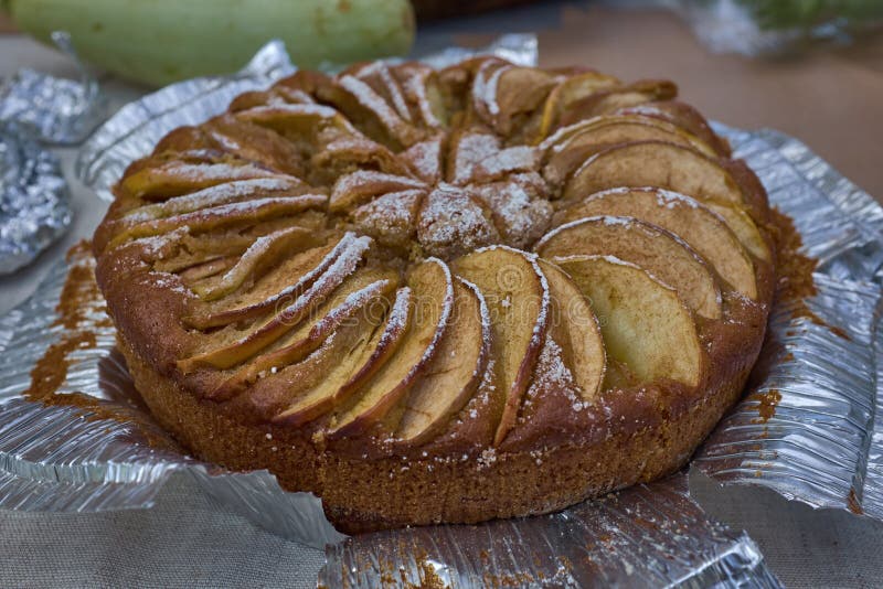 Fresh Hot Homemade Baked Apple Pie on Foil on a Table Stock Photo