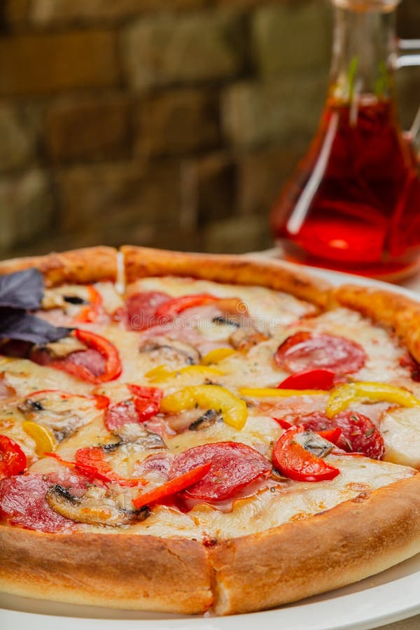 Fresh Hot Pizza on White Plate in Restaurant. Stock Image Image of