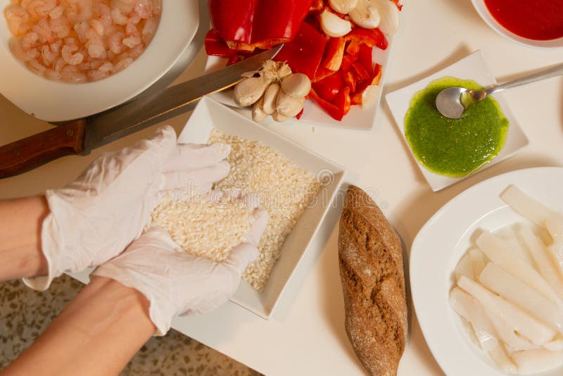 Fresh Ingredients for Paella on a White Background Stock Photo Image