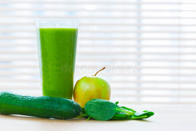 Fresh juice from green vegetables and fruits. Healthy vitamin drink.