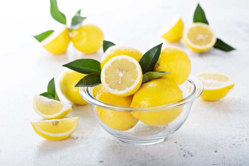 Fresh Lemons in a Glass Bowl Stock Image Image of background, leaf