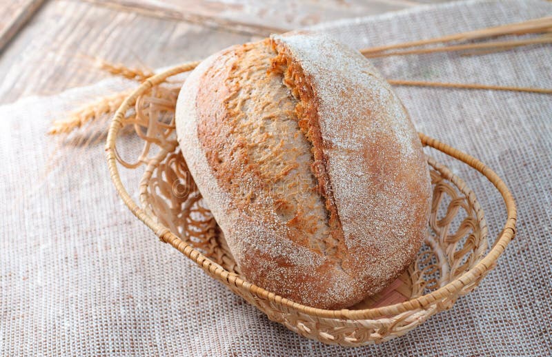 Fresh loaf of bread on a wooden background. Studio photography. stock photography Fresh loaf of bread on a wooden background. Studio photography. stock photography
