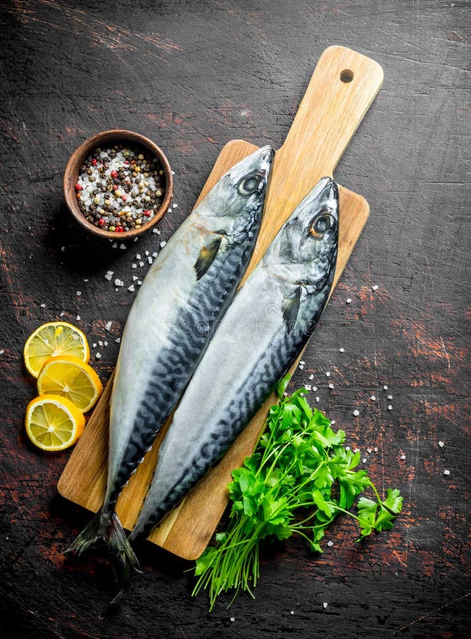 Fresh Raw Mackerel on a Stone Board with Garlic, Spices and Herbs Stock ...