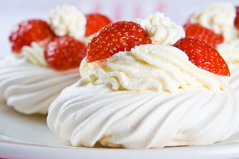 Fresh meringue with thick cream and stawberries