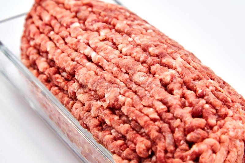 Fresh minced meat close-up in a glass dish plate.