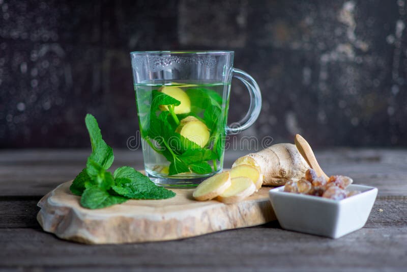Fresh Mint Ginger Tea with Mint Leaves, Ginger Bulb on Wood Stock