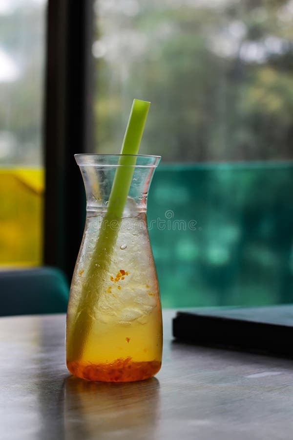 Fresh mocktail with green straw stock image
