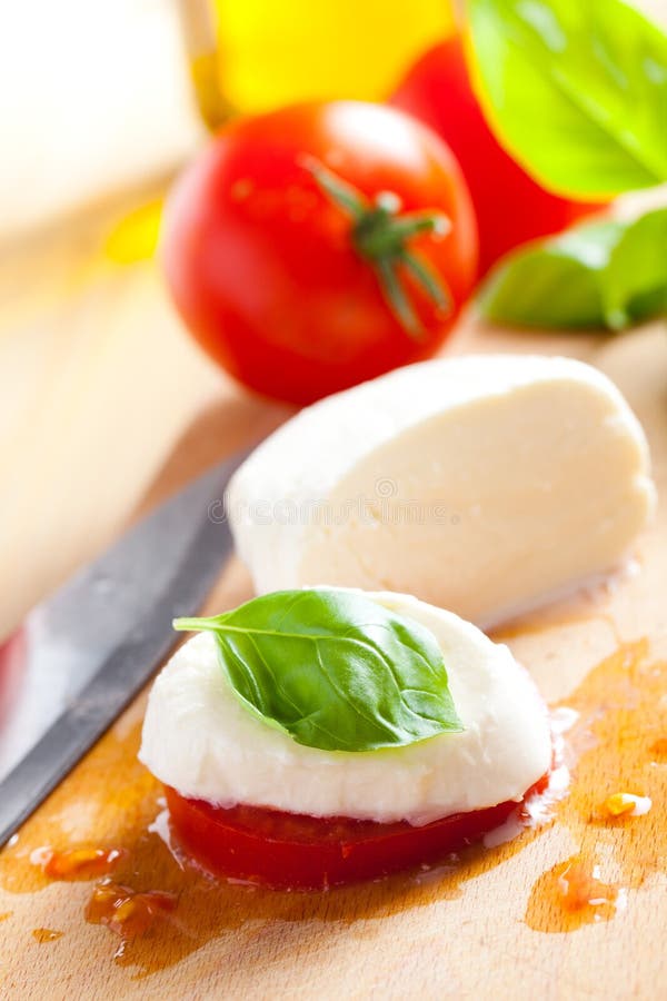 Basil Leaf, Mozzarella Cheese, Tomato Slice and Italy Flag Stock Photo
