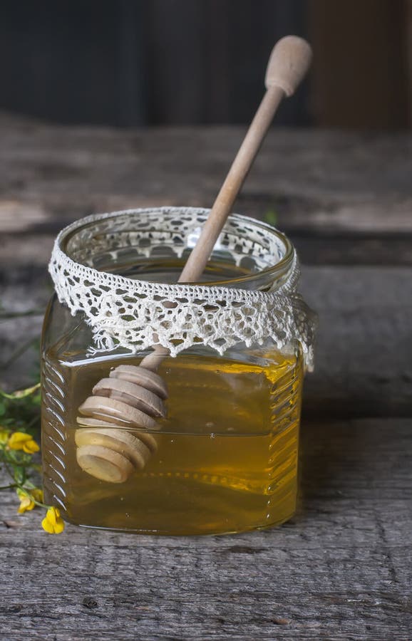 Fresh Natural Honey in a Jar with Honey Spoon on Vintage Wooden Stock ...