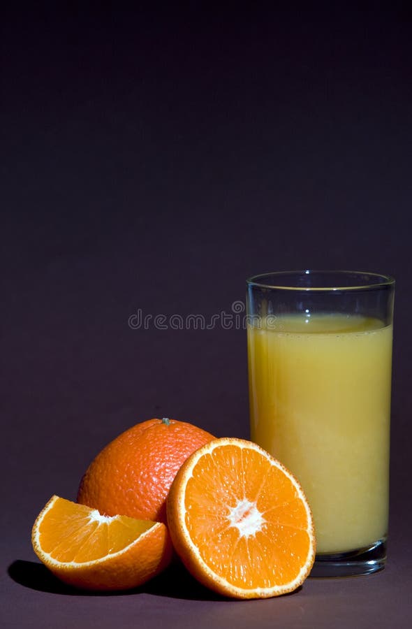 Fresh natural orange juice and orange fruits stock photos