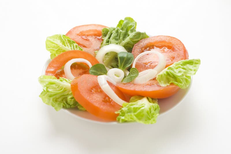 Fresh natural salad bowl tomato lettuce onion stock photo