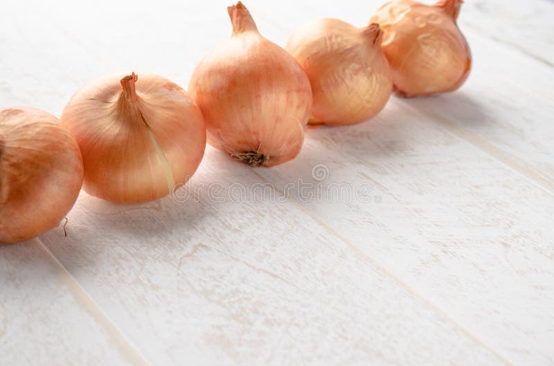 Fresh Onions On Wooden Background. Vegetables For A Healthy Diet. Vegan Food