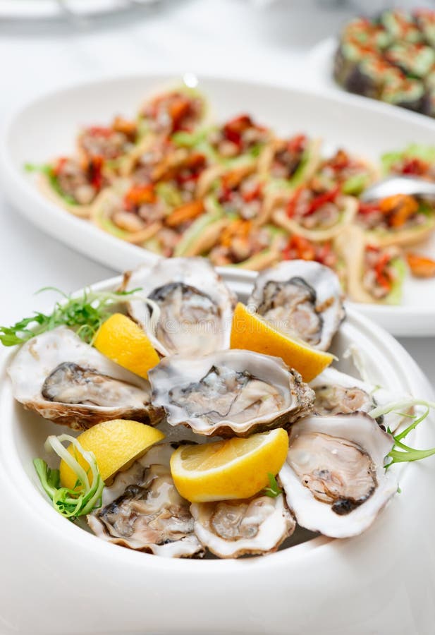 Fresh Oysters on Plate with Lemon Stock Image Image of seafood