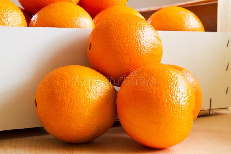 Fresh Oranges in a wooden box