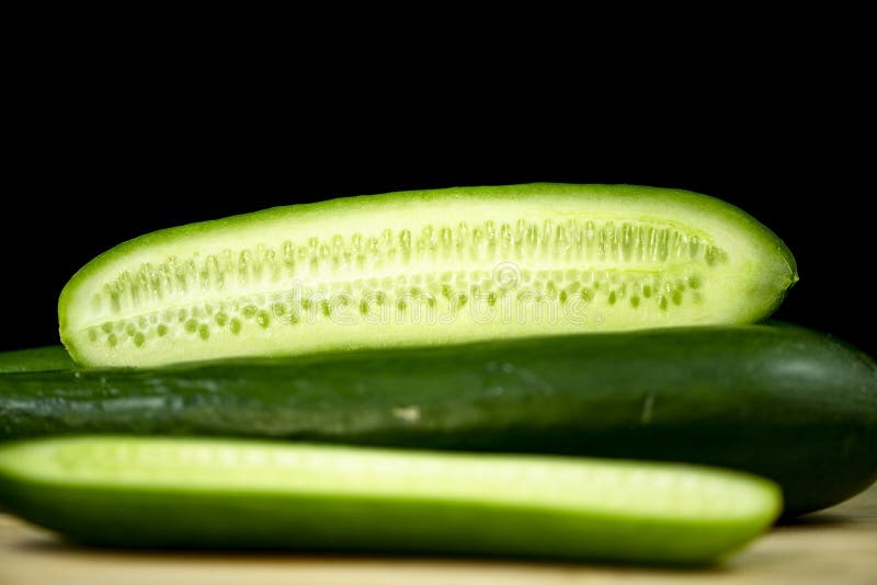 Fresh organic cucumbers on wood