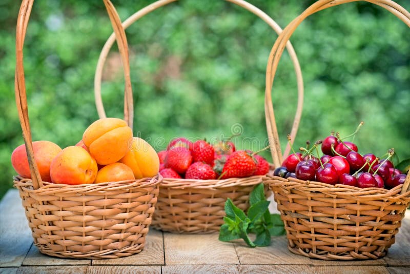 Fresh organic fruits in wicker baskets