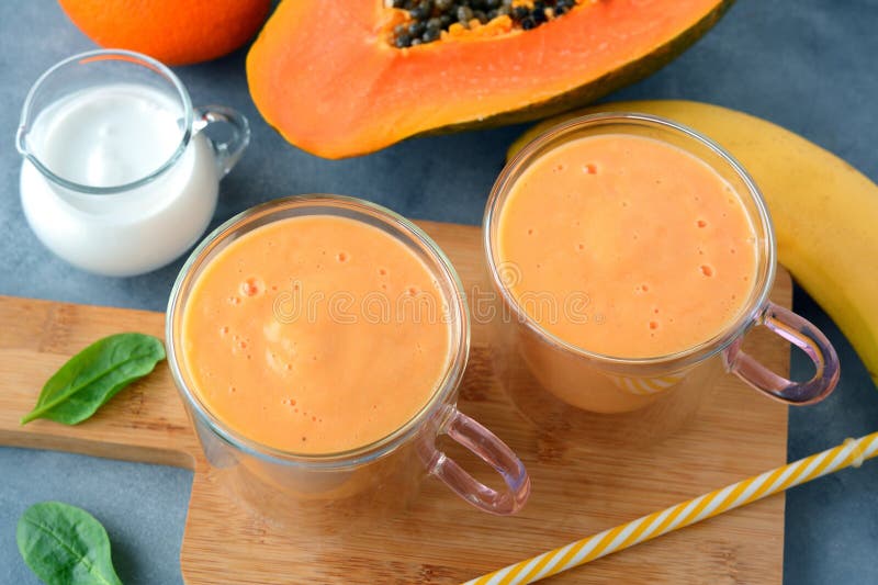 Fresh papaya, banana, orange fruit smoothie