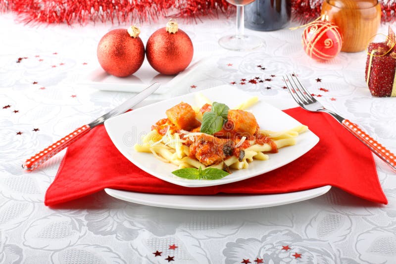 Fresh pasta with pork rind, tomato and basil royalty free stock images