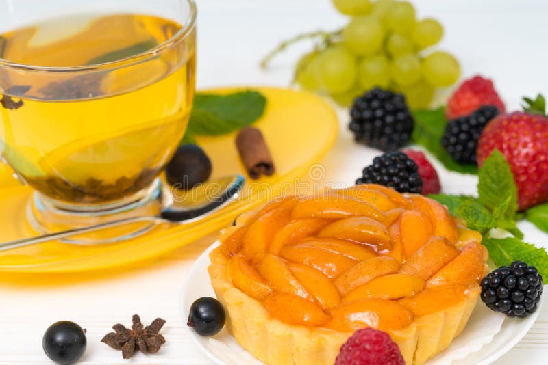 Fresh peach tart with spicy lemon tea royalty free stock image Fresh peach tart with spicy lemon tea royalty free stock image