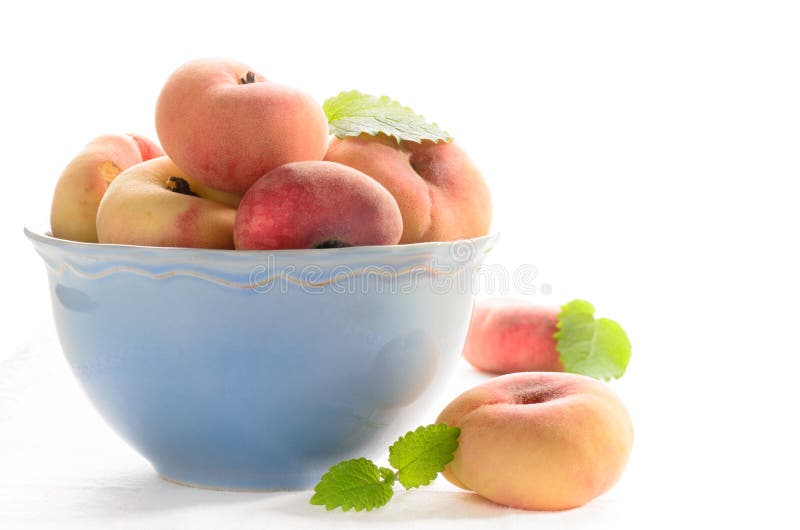 Fresh peaches in the bowl stock photo. Image of food 33056032